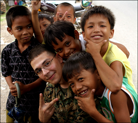 Karim with local kids during a disaster relief operation in the Philippines